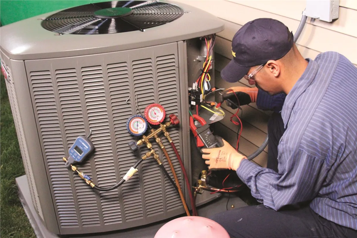 Air conditioning repair specialist with diagnostic equipment and tools